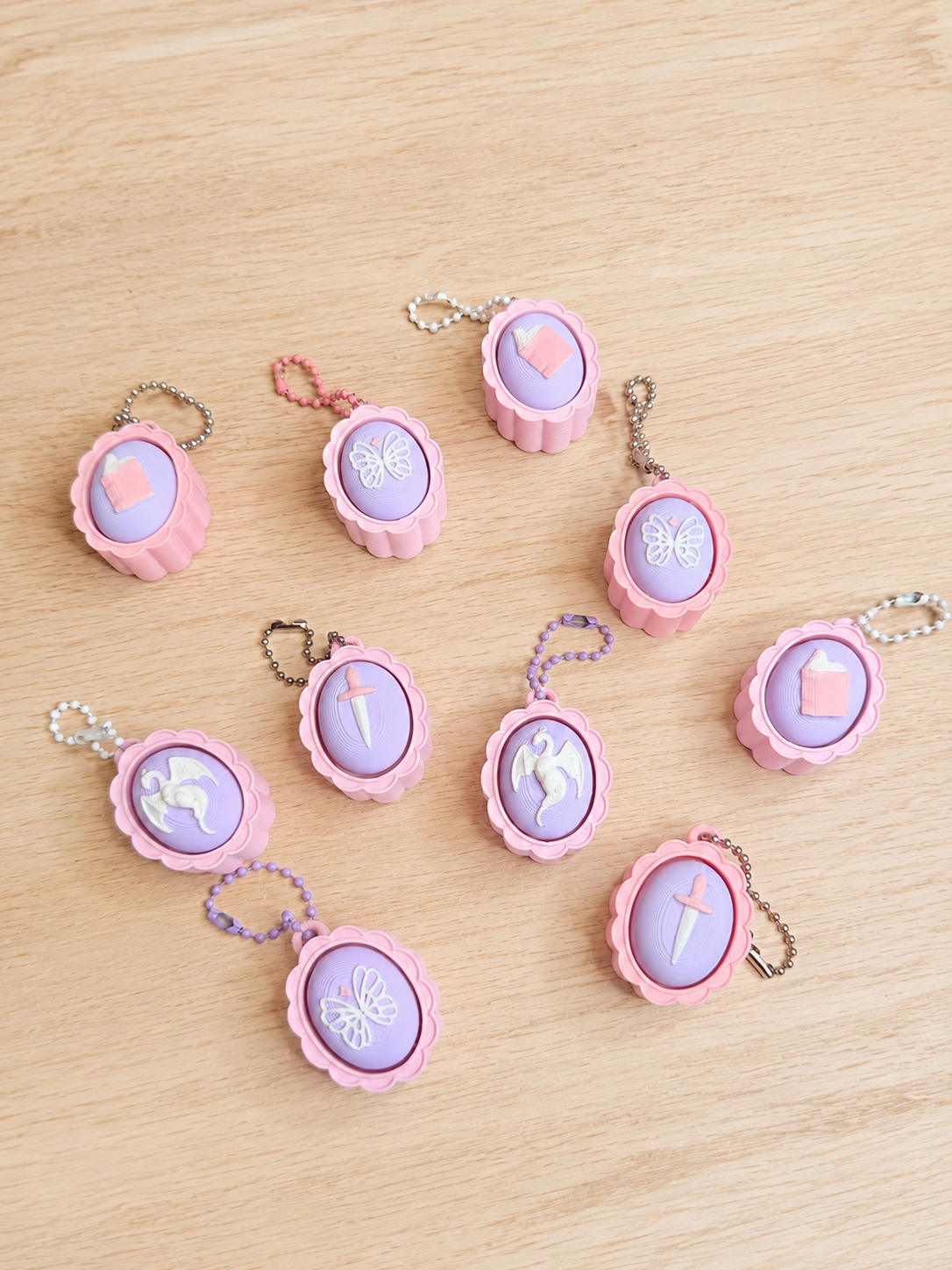 Pastel Fantasy Clicker Keychains – Dragon, Book, Sword & Butterfly