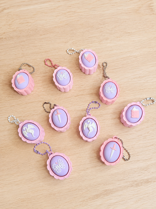 Pastel Fantasy Clicker Keychains – Dragon, Book, Sword & Butterfly